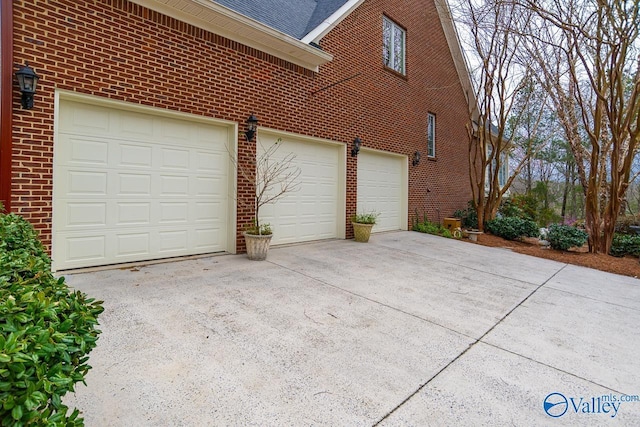 garage with concrete driveway