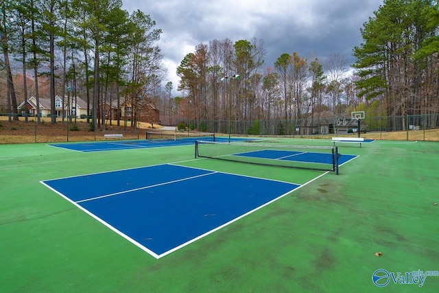 view of tennis court with fence