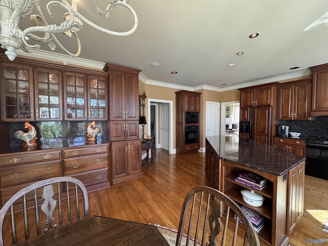 kitchen featuring open shelves, wood finished floors, black appliances, decorative backsplash, and ornamental molding