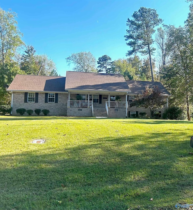 single story home with a front yard and a porch