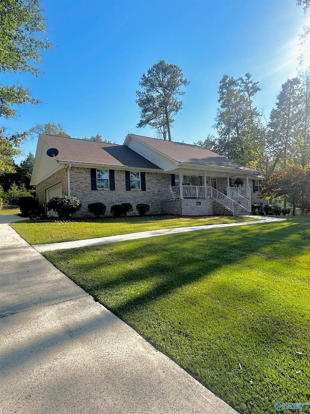 ranch-style house with a front yard and a porch