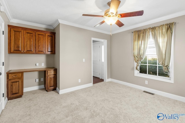 unfurnished bedroom featuring baseboards, light colored carpet, visible vents, and ornamental molding