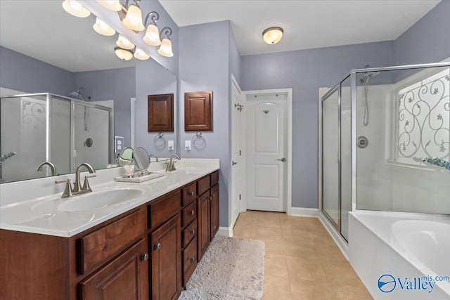 bathroom with tile patterned flooring, vanity, and independent shower and bath