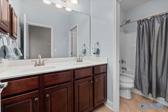 full bathroom featuring tile patterned flooring, vanity, shower / tub combo with curtain, and toilet