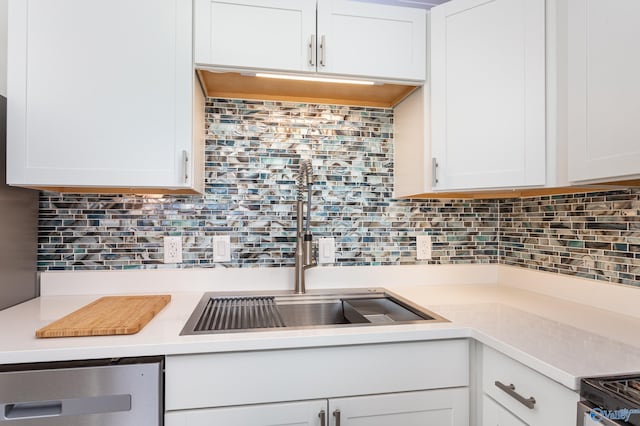 kitchen featuring white cabinetry and tasteful backsplash