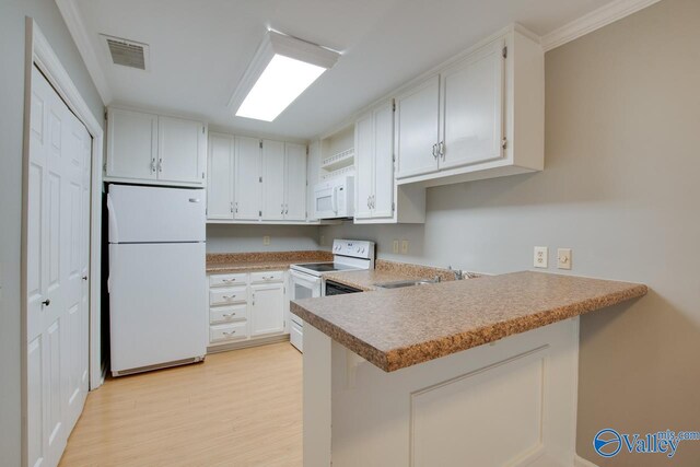 kitchen with kitchen peninsula, sink, light wood-type flooring, white cabinetry, and white appliances