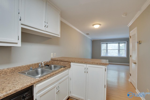 kitchen with kitchen peninsula, white cabinetry, ornamental molding, light hardwood / wood-style floors, and sink