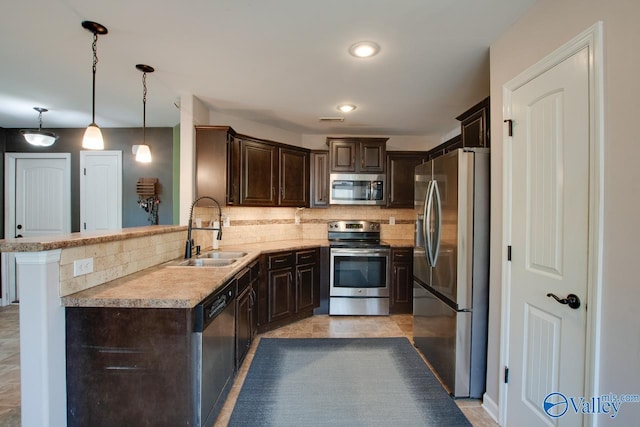 kitchen with decorative backsplash, dark brown cabinetry, stainless steel appliances, and a sink
