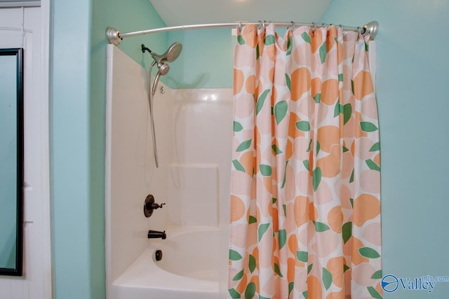 bathroom with shower / tub combo with curtain