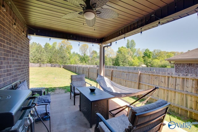 view of patio featuring a fenced backyard and a ceiling fan
