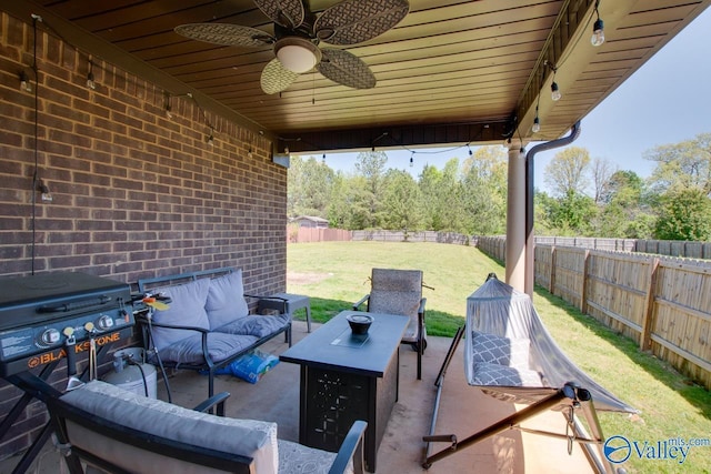 view of patio with a fenced backyard, ceiling fan, and an outdoor living space