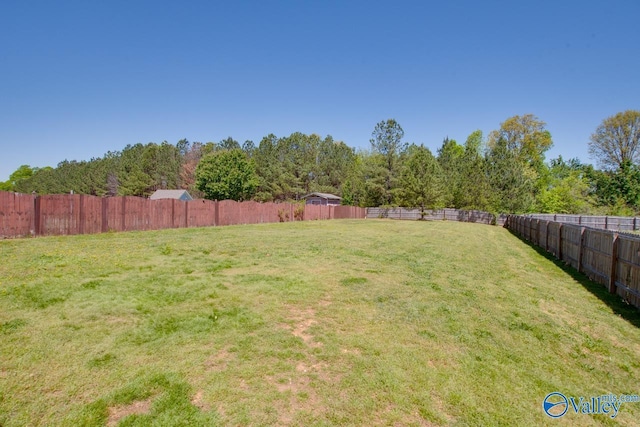 view of yard with a fenced backyard