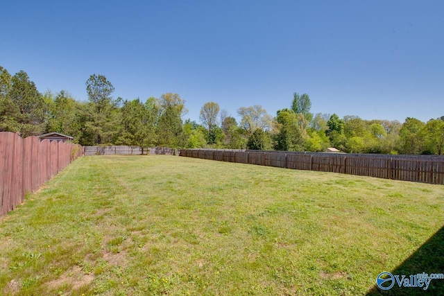 view of yard featuring a fenced backyard
