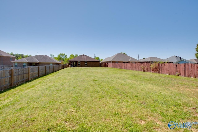 view of yard featuring a fenced backyard