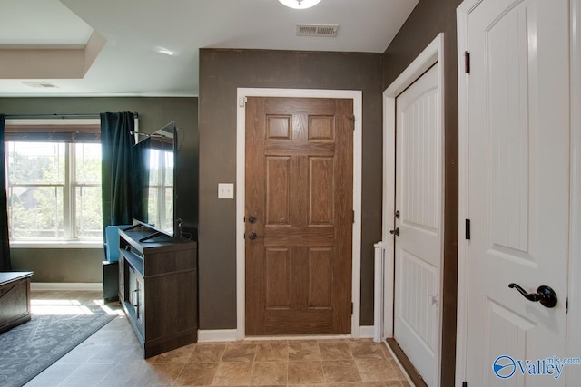 entryway featuring baseboards and visible vents