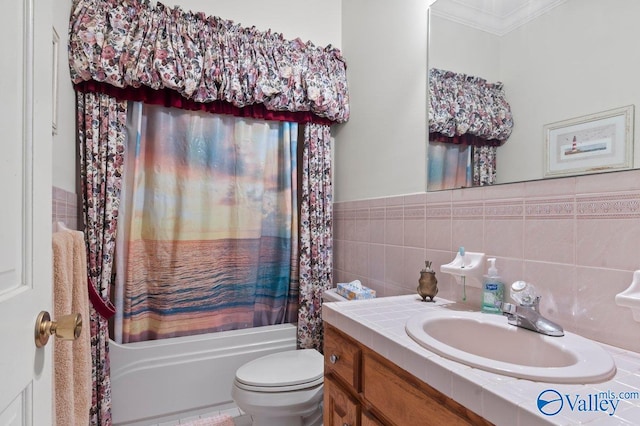 full bathroom with toilet, shower / bath combo with shower curtain, vanity, ornamental molding, and tile walls