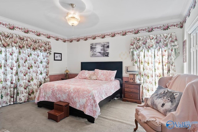 bedroom with ornamental molding, carpet, and ceiling fan