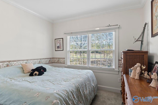 bedroom with crown molding, baseboards, and carpet floors