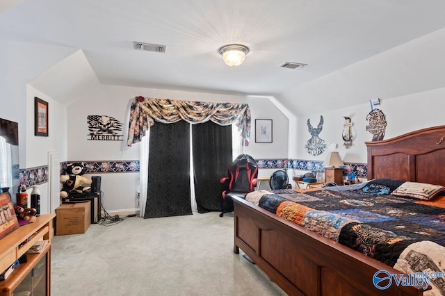 bedroom featuring light colored carpet, visible vents, and lofted ceiling