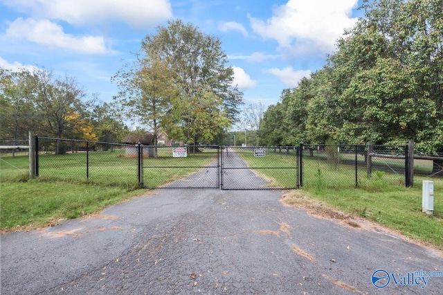view of street featuring a gate