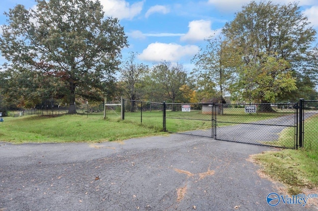 view of street featuring a gate and a gated entry