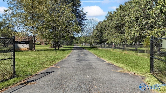 view of street featuring a gated entry
