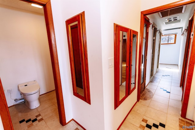 hallway with french doors, visible vents, a wall mounted AC, and light tile patterned flooring