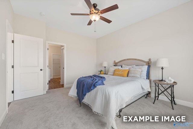 carpeted bedroom with baseboards and ceiling fan