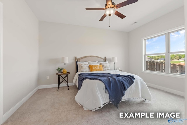 bedroom featuring carpet floors, a ceiling fan, and baseboards