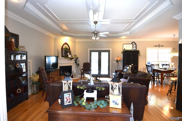 living room with ceiling fan, hardwood / wood-style floors, and a healthy amount of sunlight