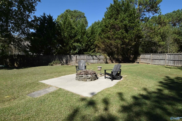 view of yard featuring a patio and an outdoor fire pit