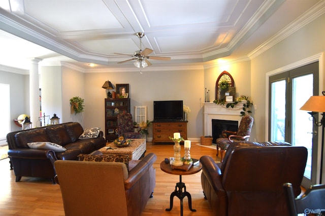 living room with ornate columns, ceiling fan, coffered ceiling, crown molding, and light hardwood / wood-style floors