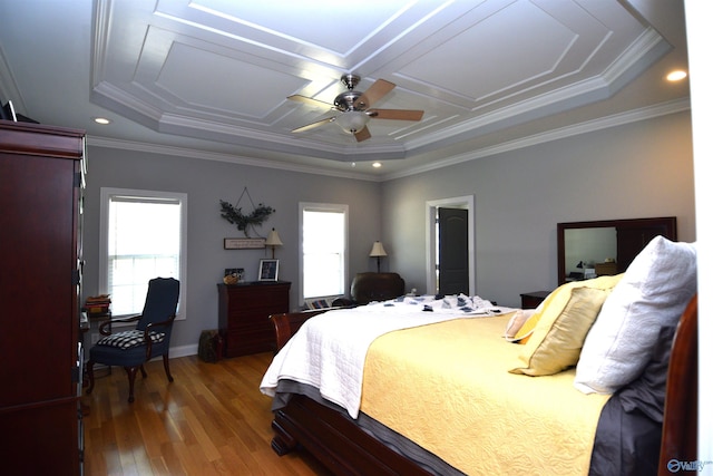 bedroom featuring hardwood / wood-style flooring, ceiling fan, crown molding, and multiple windows