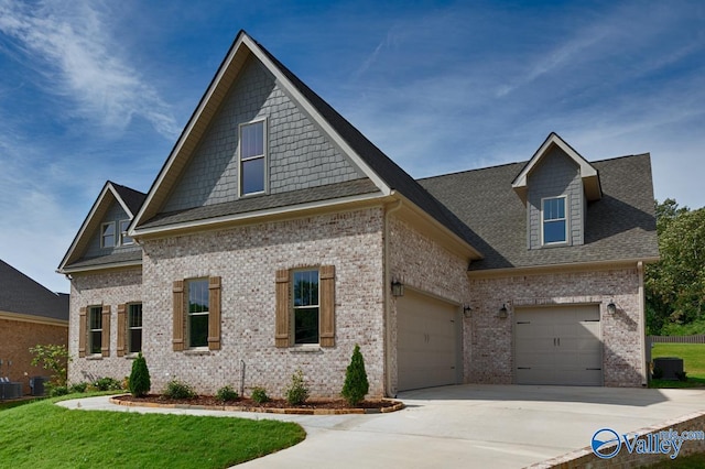 view of front of home with a garage and a front yard