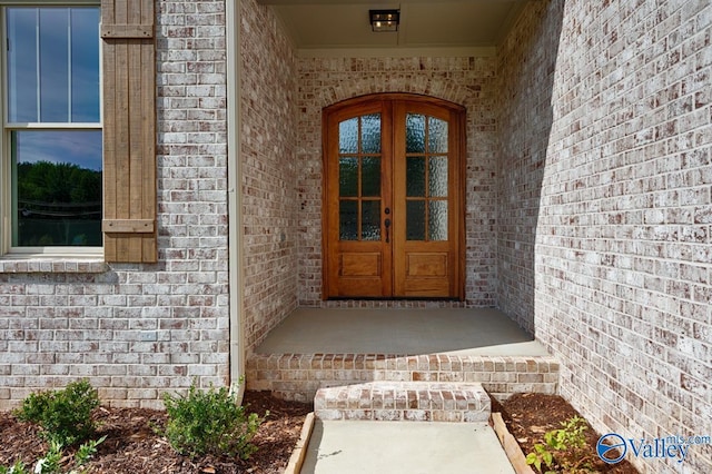 entrance to property featuring french doors