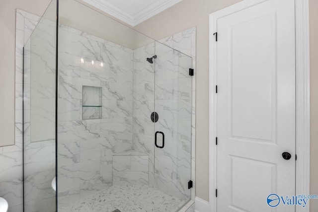 bathroom with crown molding and an enclosed shower