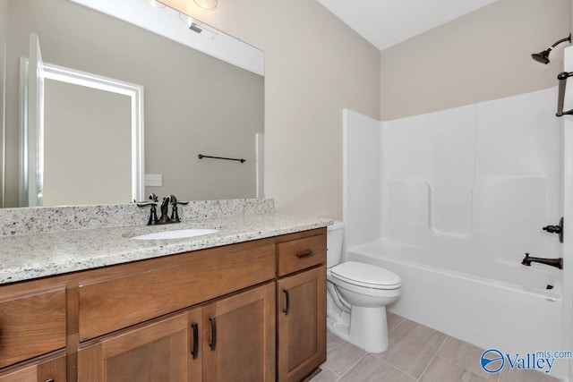 full bathroom featuring vanity, bathing tub / shower combination, and toilet