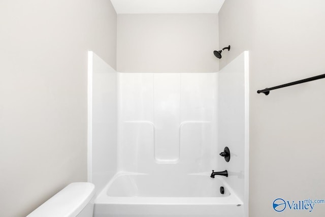 bathroom with shower / bathtub combination and toilet