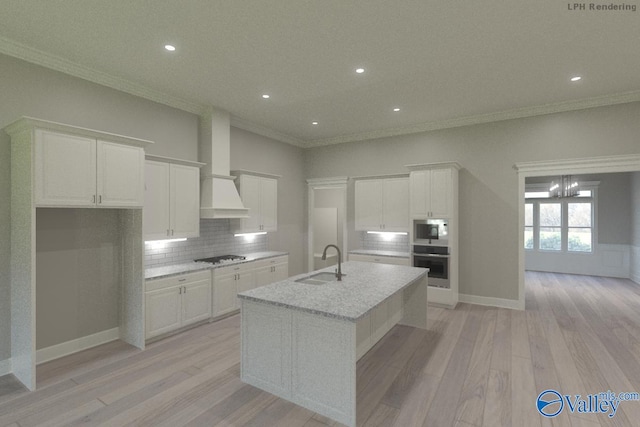 kitchen featuring light stone counters, stainless steel appliances, a kitchen island with sink, a sink, and white cabinetry