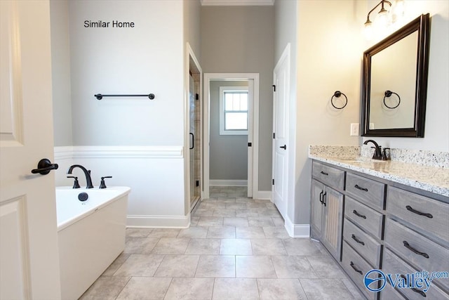 full bath with baseboards, a soaking tub, tile patterned flooring, vanity, and a shower stall