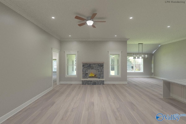 unfurnished living room featuring light wood-style flooring, a fireplace, baseboards, and crown molding