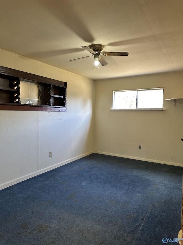 carpeted empty room featuring ceiling fan