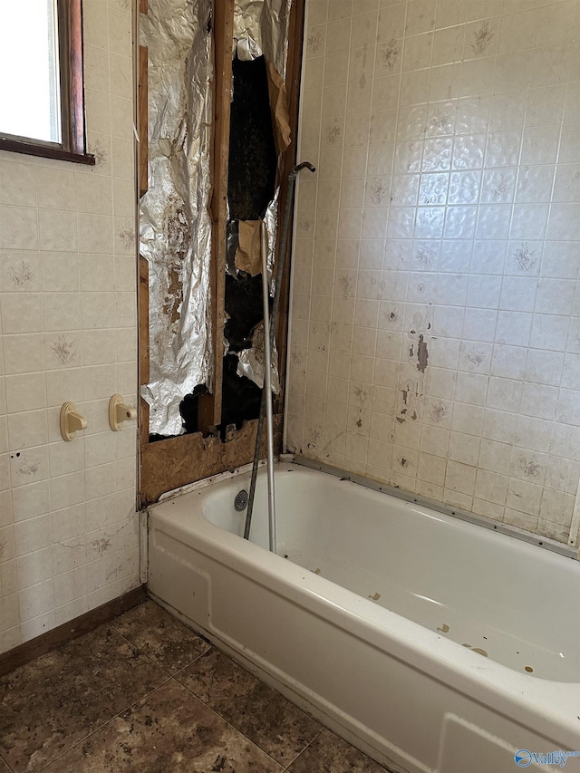 bathroom featuring a tub to relax in