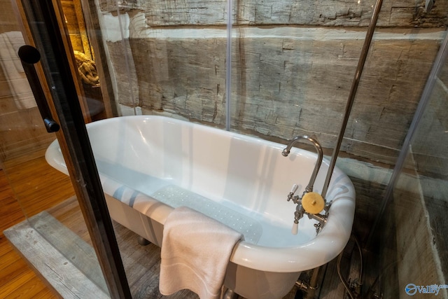 bathroom featuring a bathing tub and hardwood / wood-style floors