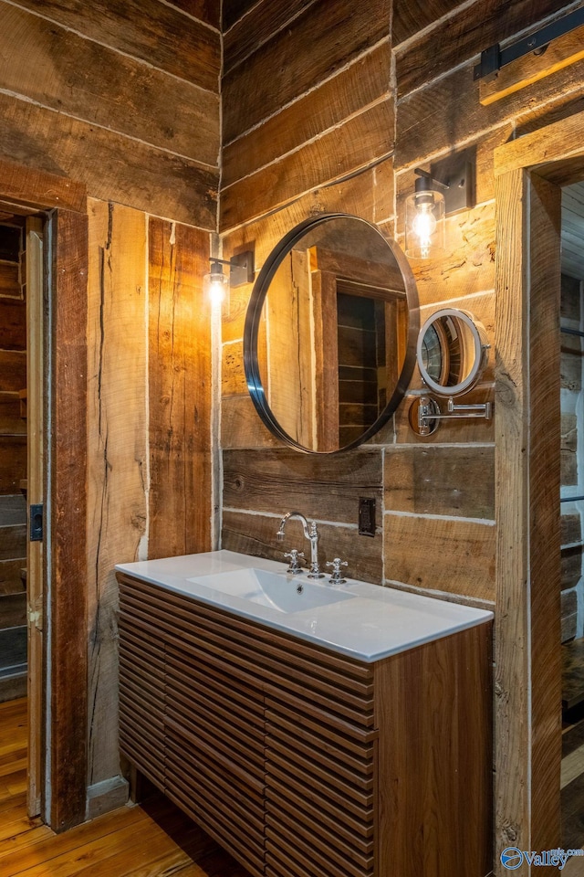 bathroom featuring vanity and hardwood / wood-style floors