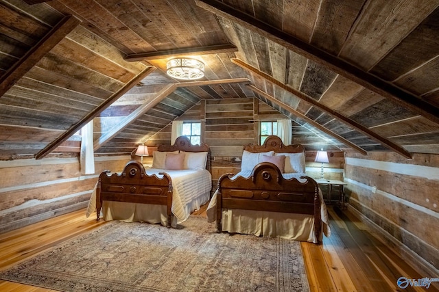 bedroom with wood-type flooring, vaulted ceiling, wooden ceiling, and wooden walls