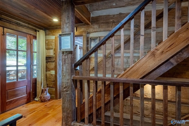 staircase featuring wood-type flooring