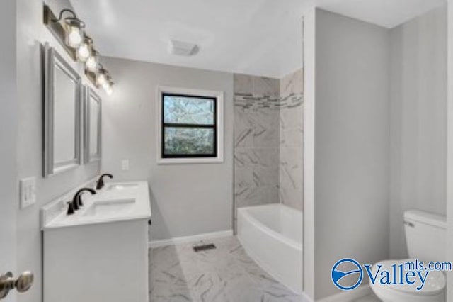 full bath featuring double vanity, toilet, baseboards, and marble finish floor