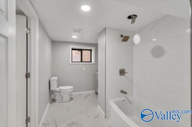 full bath featuring marble finish floor, toilet,  shower combination, and baseboards