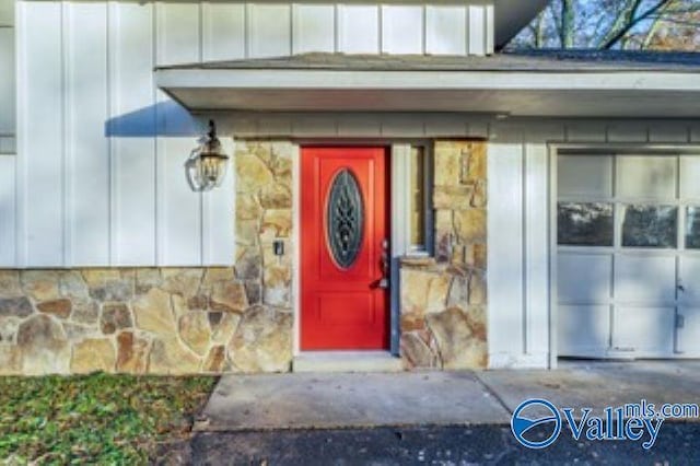 property entrance with board and batten siding